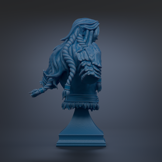 A blue bust sculpture with intricate braided hair and a detailed design, displayed on a pedestal against a dark background.