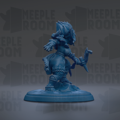 A blue figurine of a warrior-like character with a fierce expression and wielding a weapon, standing on a base.