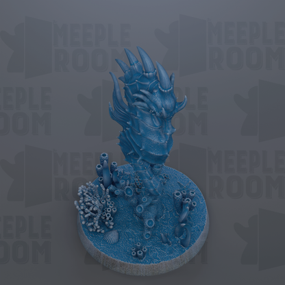 A 3D rendering of a blue, fantastical creature resembling a dragon or sea monster, with sharp teeth and a large head, standing on a circular base with various marine life elements.