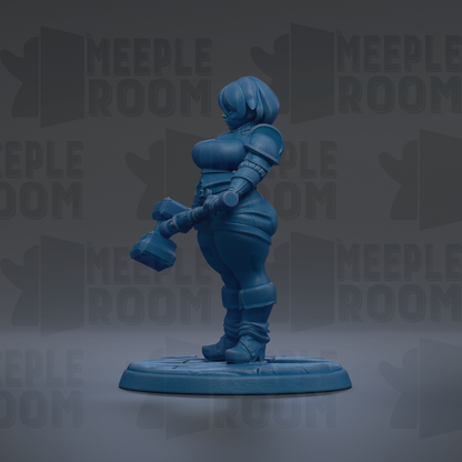 A blue figurine of a female character, possibly a warrior or princess, standing on a platform and holding a weapon.