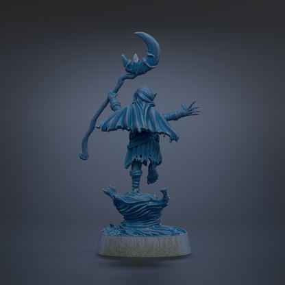 A blue, 3D-rendered statue of a figure holding a staff and a crescent moon, standing on a rock.