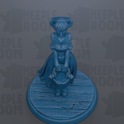 A blue figurine of a woman with a hat and dress, standing on a wooden base.