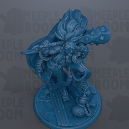 A blue figurine of a warrior-like character with a sword and shield, standing on a platform and holding a shield in one hand and a spear in the other.