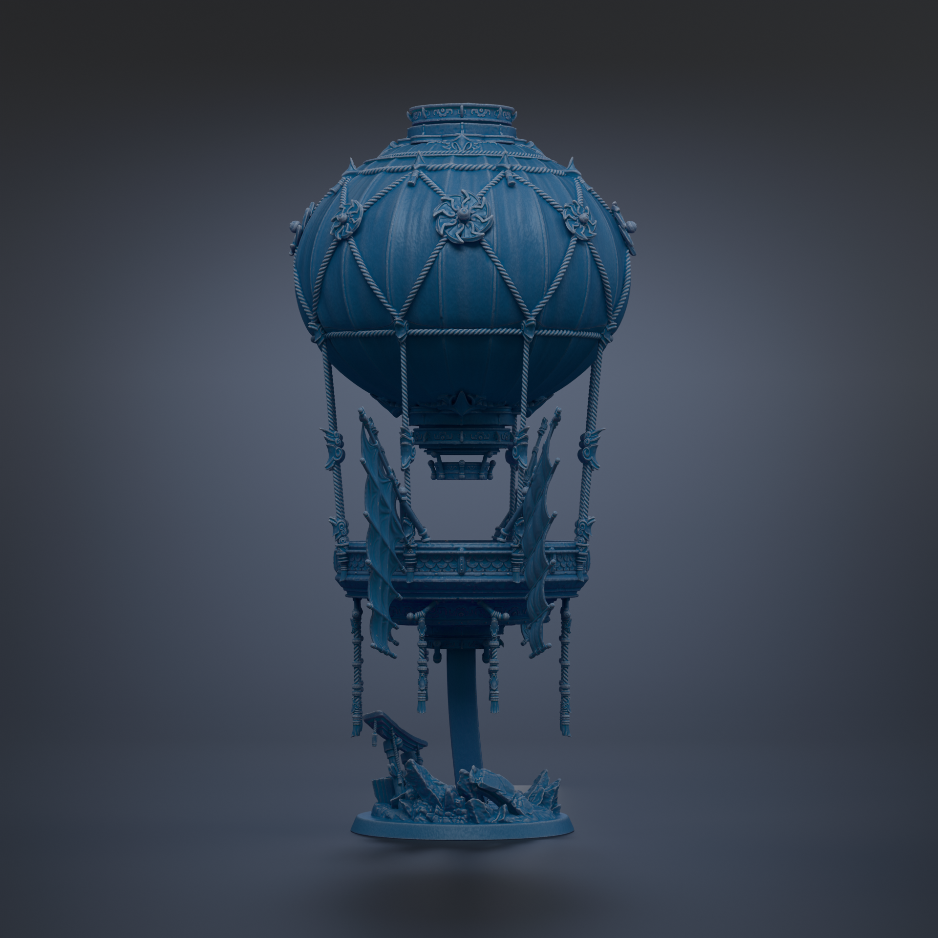 A blue, ornate hot air balloon sculpture stands against a dark background.