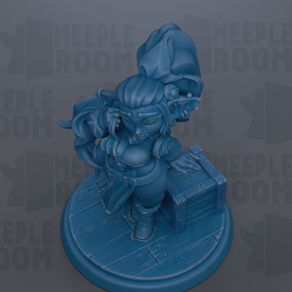 A blue figurine of a character with a pointed hat and beard, standing on a wooden base.
