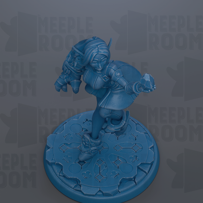 A blue figurine of a female character with a shield, standing on a blue platform with a geometric pattern.