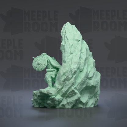 A green statue of a person sitting on a rock formation, with the text "MEUPLE ROOM" repeated in the background.