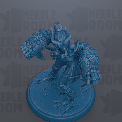 A blue figurine of a warrior-like character with horns and a flowing skirt, standing on a wooden base.