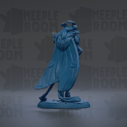 A blue figurine of a winged creature with a long tail, standing on a base.