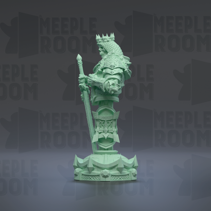 A green statue of a knight holding a sword and shield, standing on a pedestal.
