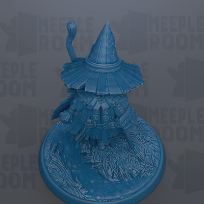 A blue, 3D-rendered wizard figurine with a pointed hat and a staff, standing on a circular base with intricate designs.
