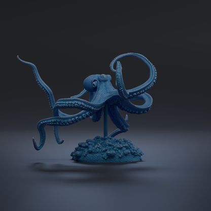 A blue octopus figurine with its tentacles spread out, standing on a small base with rocks.