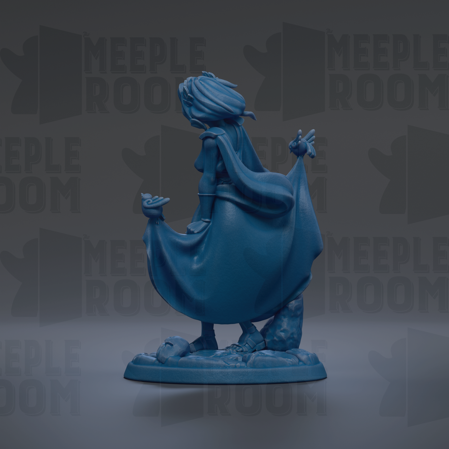 A blue figurine of a woman with flowing hair and a flowing cape, standing on a base with a rock formation.