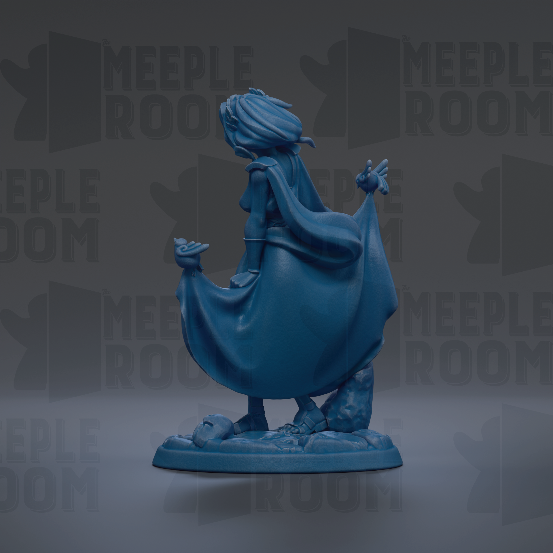 A blue figurine of a woman with flowing hair and a flowing cape, standing on a base with a rock formation.