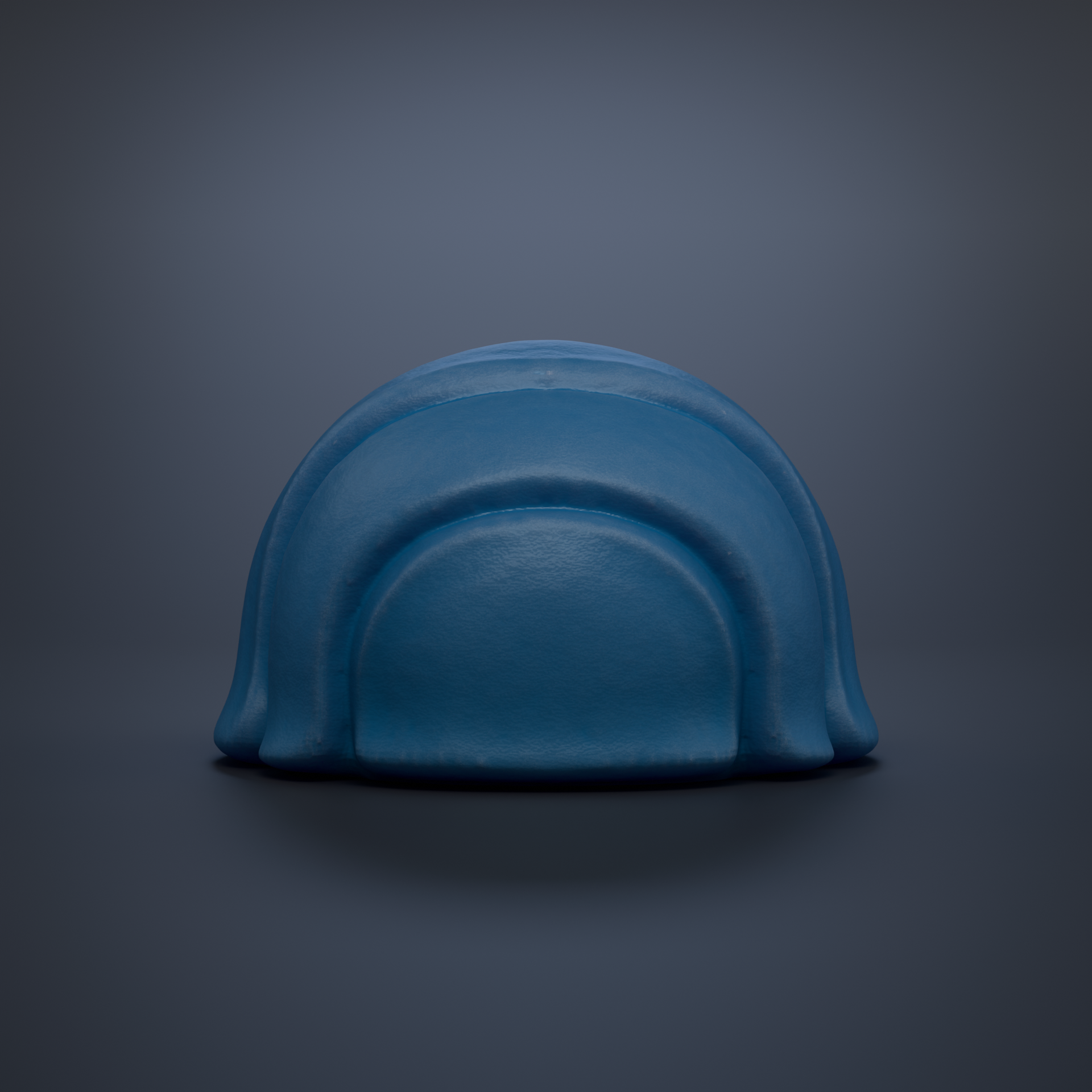 A blue, curved object resembling a helmet or hat is shown against a dark background.