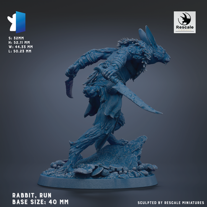 a blue rabbit statue with a sword in its hand, standing on a rock formation.
