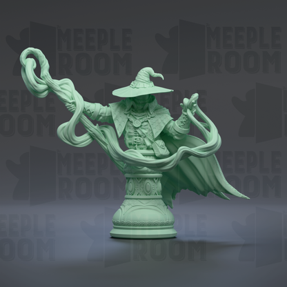 A green statue of a wizard or magical figure holding a staff and surrounded by a flowing, ethereal mist.