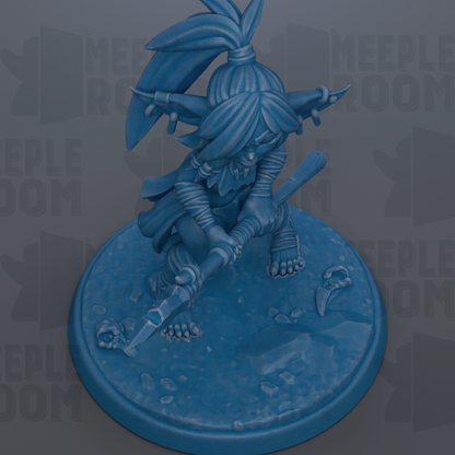 A blue figurine of a character with a pointed hat and a sword, standing on a blue base.