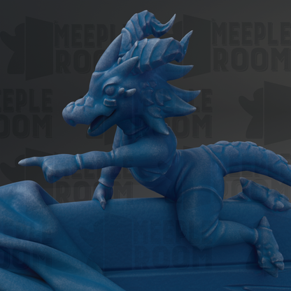 A blue dragon statue with a pointed nose and curled horns is depicted in the image.