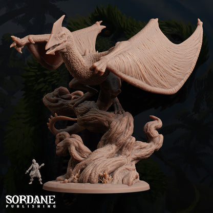 a statue of a dragon with a human figure next to it