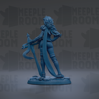 A blue figurine of a female character with a long, flowing skirt and a large headdress, holding a sword and standing on a platform.