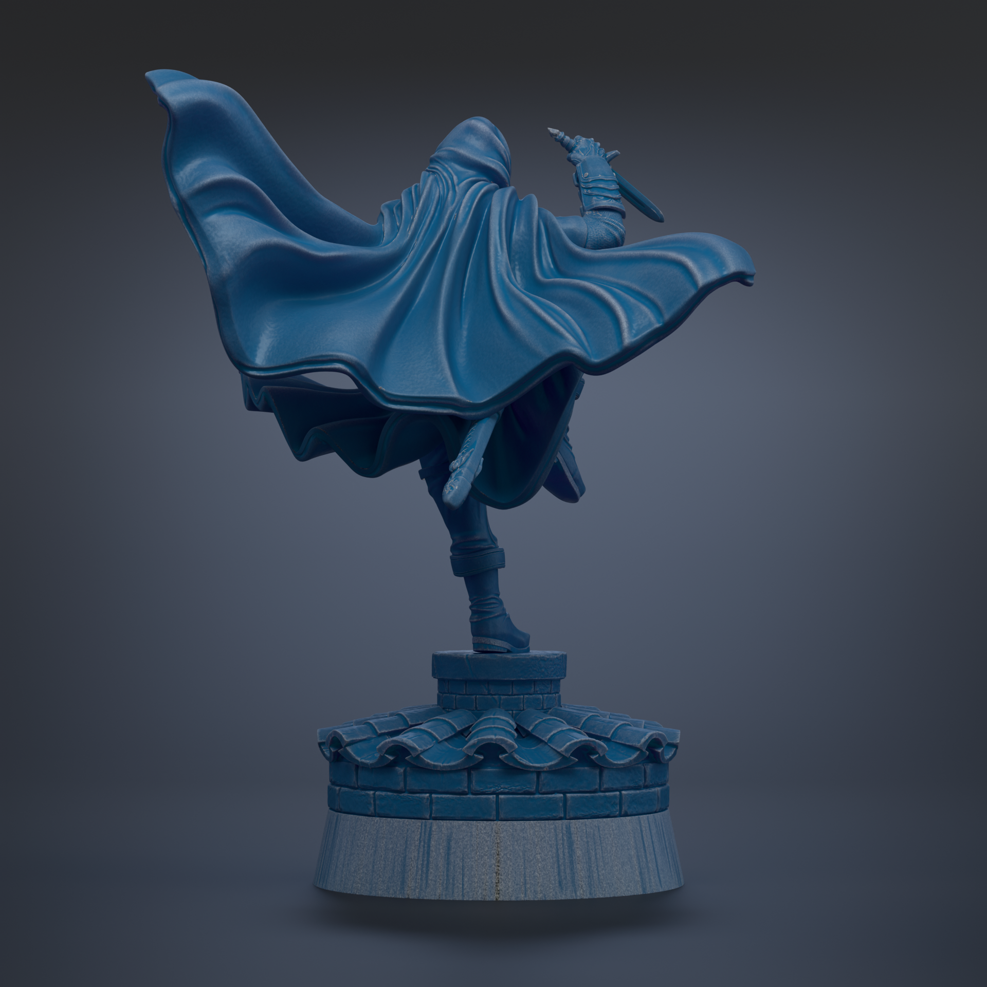 A blue statue of a person in a flowing cape, holding a sword, standing on a pedestal.