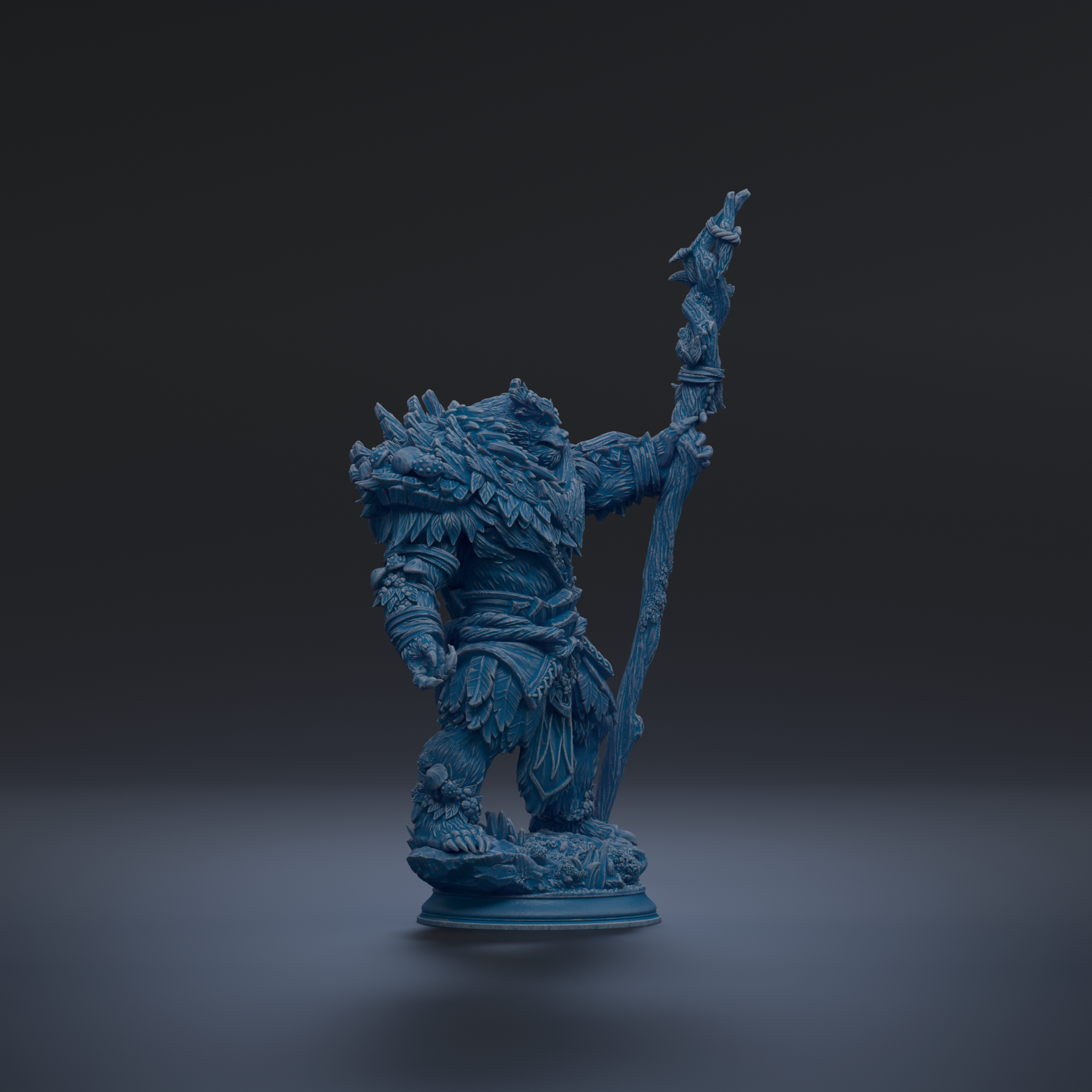 A blue figurine of a fantastical creature, possibly a dragon or serpent, standing on a pedestal and holding a staff or staff-like object.