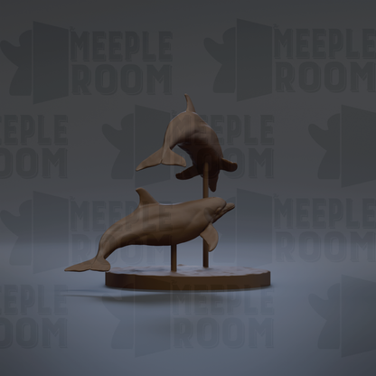 A 3D rendering of a pair of dolphins on a circular base, with the background featuring the text "MEEPLE ROOM" repeated multiple times.