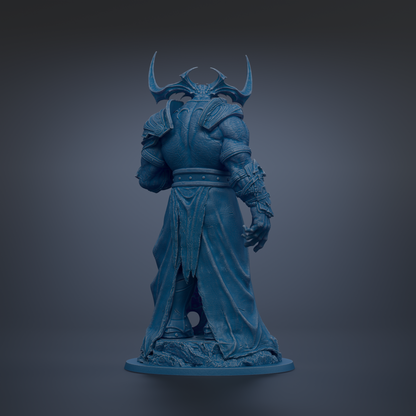 A dark blue, sculpted statue of a fantastical creature with horns and a flowing robe, standing on a pedestal against a dark background.