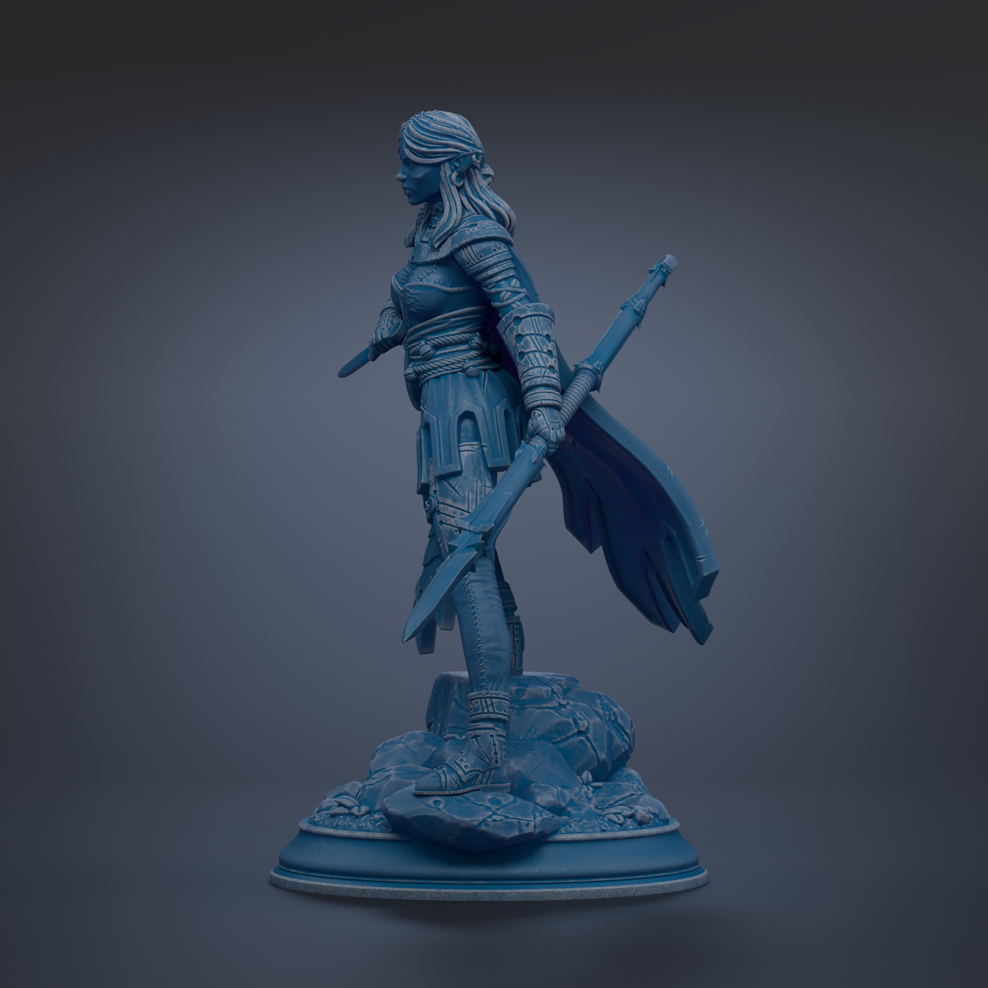 A blue statue of a female warrior standing on a rock base, holding a sword and shield.