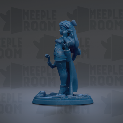A blue figurine of a woman with a sword and a headdress, standing on a base.