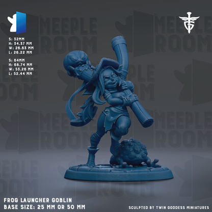 The image is a figurine of a frog-like creature, possibly a gnome or deity, with a large pipe or staff in its hands. The figurine is set against a dark background with the text "MEIPLE ROOM" repeated multiple times. The figurine is described as a "FROG LAUNCHER GOBLIN" and has a base size of 25mm or 50mm. It is sculpted by "TWIN GODESS MINUTES".