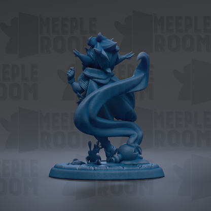 A blue figurine of a character with a flowing cape and wings, standing on a base with a textured surface.