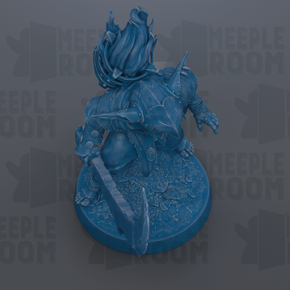A blue figurine of a fantastical creature with flames or fire emanating from its head, standing on a circular base.
