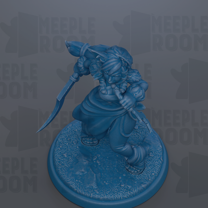 A blue figurine of a character with a sword and shield, standing on a circular base.