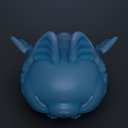 A blue, cartoon-like object with large ears and a round body, resembling a small animal or creature.