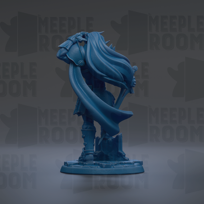 A blue figurine of a person with a flowing cape, standing on a base and facing to the right.