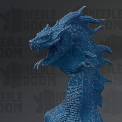 A close-up view of a blue, detailed dragon sculpture with its mouth open, appearing to be in motion.