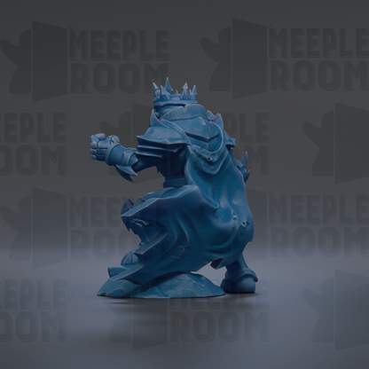 A blue, armored figure with a crown on its head, standing on a rock.