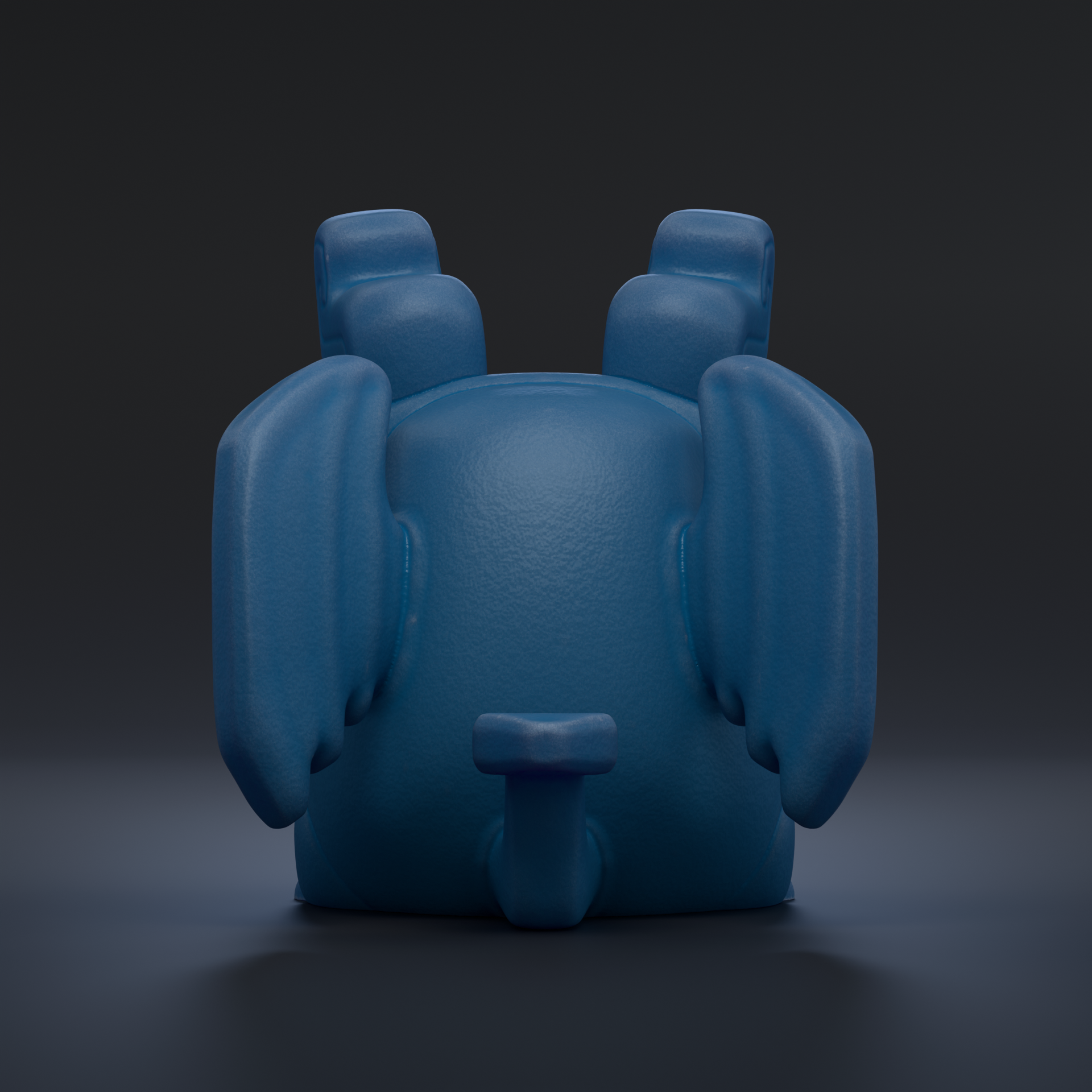 A blue, three-dimensional toy or figurine is shown against a dark background.