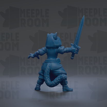 A blue toy figurine holding a sword and standing in a fighting stance.