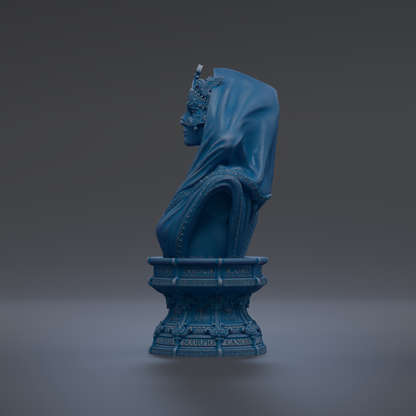 A blue bust sculpture of a woman with a flowing robe and headdress, standing on a pedestal with ornate designs.