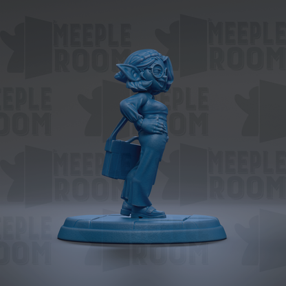 A blue figurine of a person standing on a platform, wearing a hat and holding a bag.