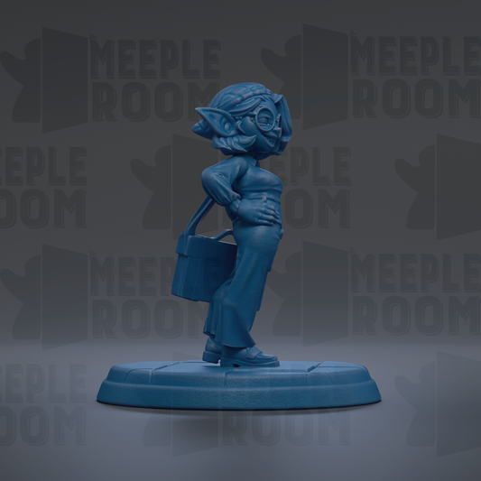A blue figurine of a person standing on a platform, wearing a hat and holding a bag.