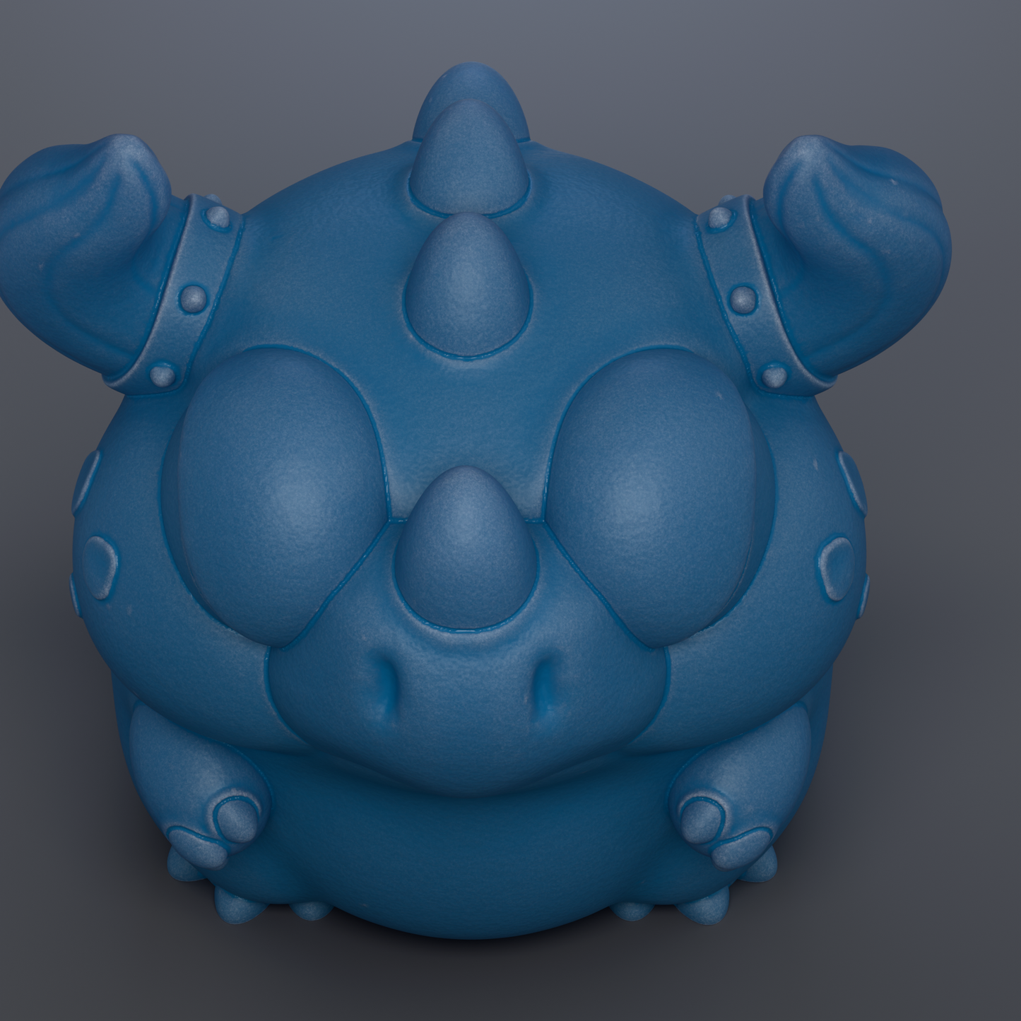 A blue, cartoon-like creature with large eyes and spikes protruding from its head.