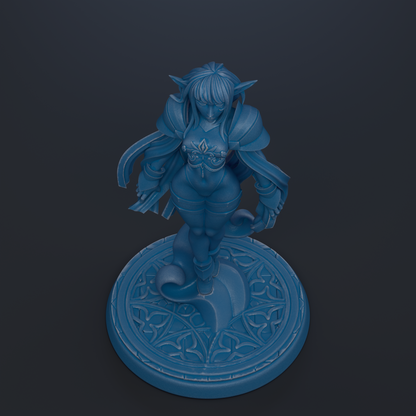 A blue figurine of a female character with long hair and a flowing robe, standing on a circular base with an intricate design.