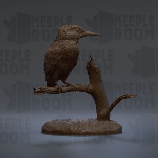 A bronze bird statue perched on a branch, with the text "MEUPLE ROOM" visible in the background.