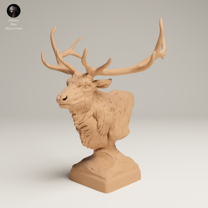 a statue of a deer with antlers on it's head