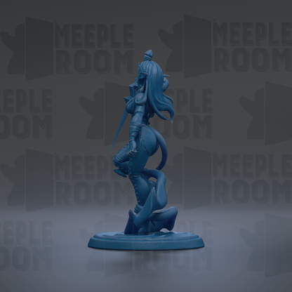 A blue figurine of a female character with long hair and a flowing skirt, standing on a base and holding a weapon.