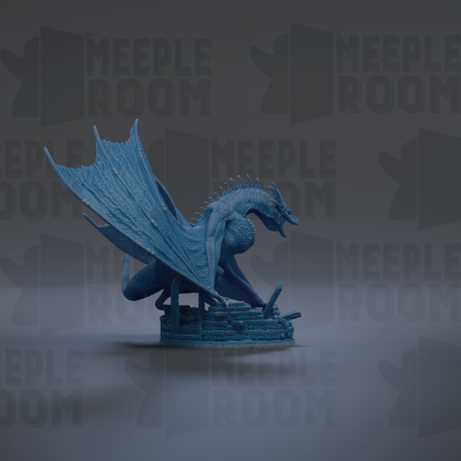 A blue dragon figurine is depicted in a dynamic pose, with its wings spread wide and its head turned to the side.